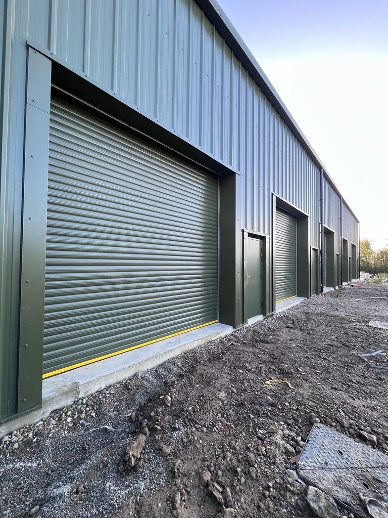 Commercial steel building with roller shutters