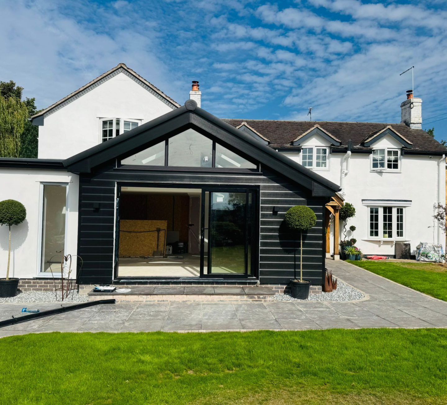 Completed garden room extension with full-height glazing