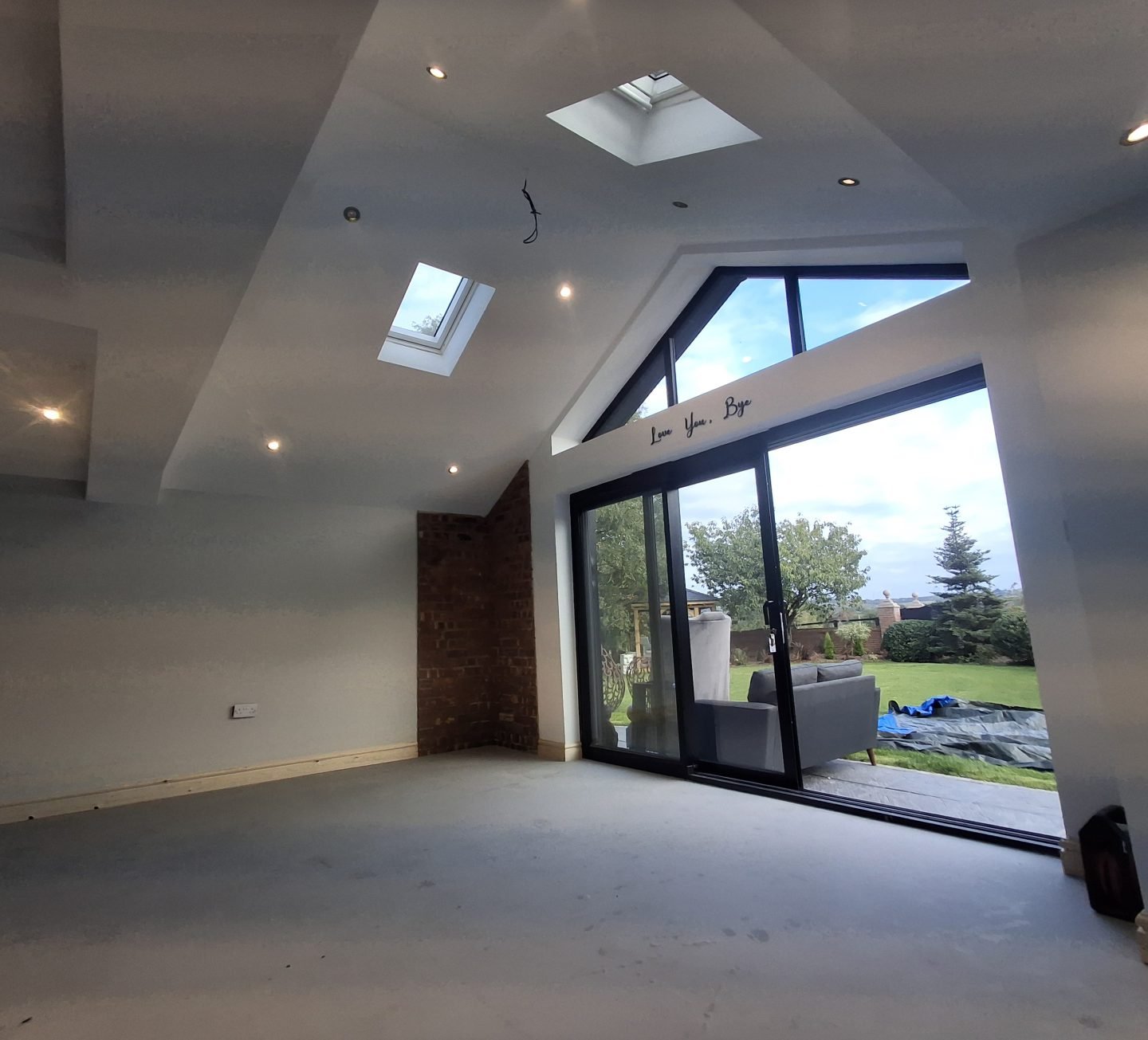 Interior of a Gilbert O'Neill project mid-construction, freshly plastered with new glazing installed